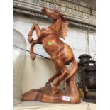Large wooden horse figure