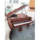 A Laurent baby grand piano, w142cm, h96cm, d125cm approx.