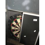 A Unicorn darts board in aluminium case.