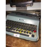 A vintage Olivetti Lettera 32 typewriter in original case.