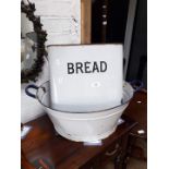 An enamel bath, bread bin and smaller metal items