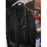 A JTS motorcycle leather suit comprised of trousers and jacket.