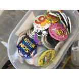 A small tub of badges