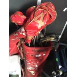 A golf bag with set of golf clubs.