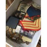 A box of world coins, badges, banknotes, medals, Liverpool cufflinks and badge, etc.