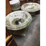 A pair of concrete garden planters