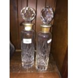 A pair of decanters with epns collars