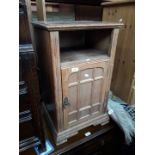 An oak bedside cabinet