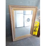 A large gilt framed mirror