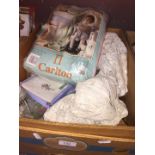 A box of linen, doilies, curtains, etc.