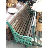 A garden bench with cast metal ends