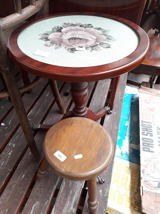 A small stool and a tripod table with tapestry top