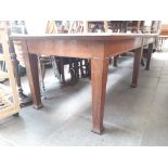 A large oak library table with green top, 275 x 100cm.