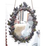 A small ornate cast frame mirror