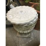 A stoneware planter and two plaster ceiling roses