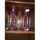 A pair of repro cranberry glass vases with lustre drops.