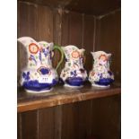 Set of three graduated gaudy jugs. Circa 1900