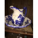 A blue and white jug and basin