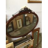 Oval mahogany mirror with carving