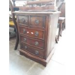 A mahogany reproduction chest of drawers