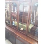 A two part lounge display cabinet.