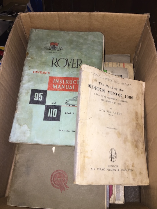 A box of old car books.