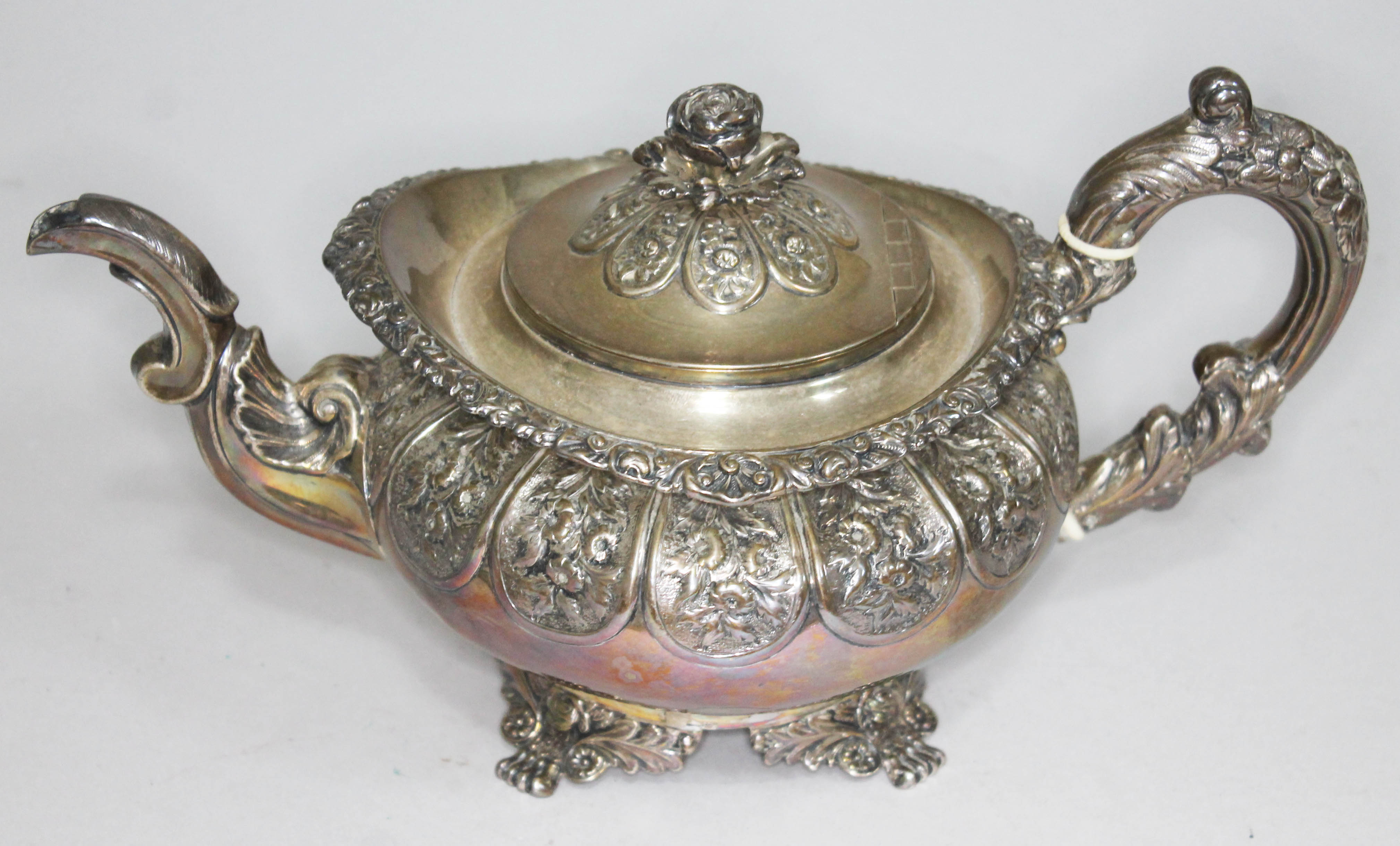 A George IV silver teapot, London 1825, gross wt. 25oz, length 30cm. Condition - rubbing to