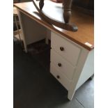 A modern single pedestal desk with 3 drawers