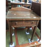 An oak side table with drawer