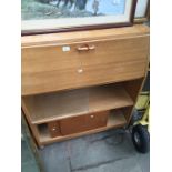 A light oak bureau with glass slide doors