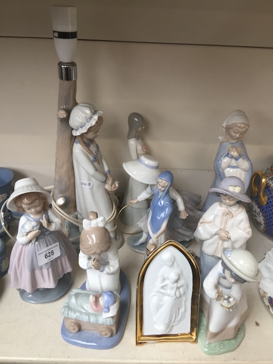 Seven Nao figures, one spanish figure, another unmarked and a Limoges plaque