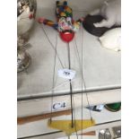 A harlequin string puppet.