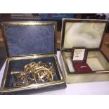 Two onyx style boxes with gold coloured jewellery
