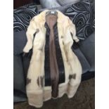 A vintage full length segmented colour mink fur and leather trimmings coat with leather belt, 2 side