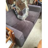 A grey cloth sofa bed