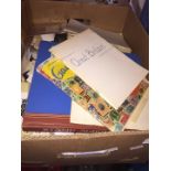 A box of stamp albums and covers