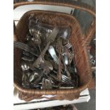 A vintage basket of EPNS cutlery