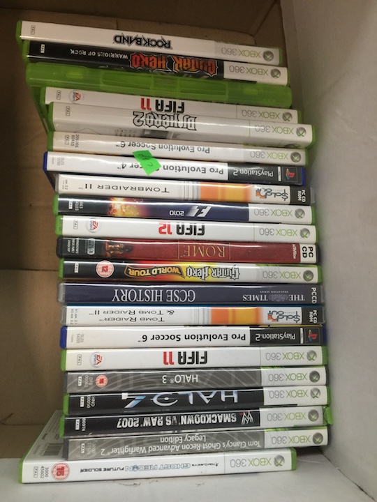 A box of Xbox 360 and other games.