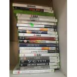 A box of Xbox 360 and other games.