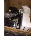 A box containing 2 Wii consoles and various accessories