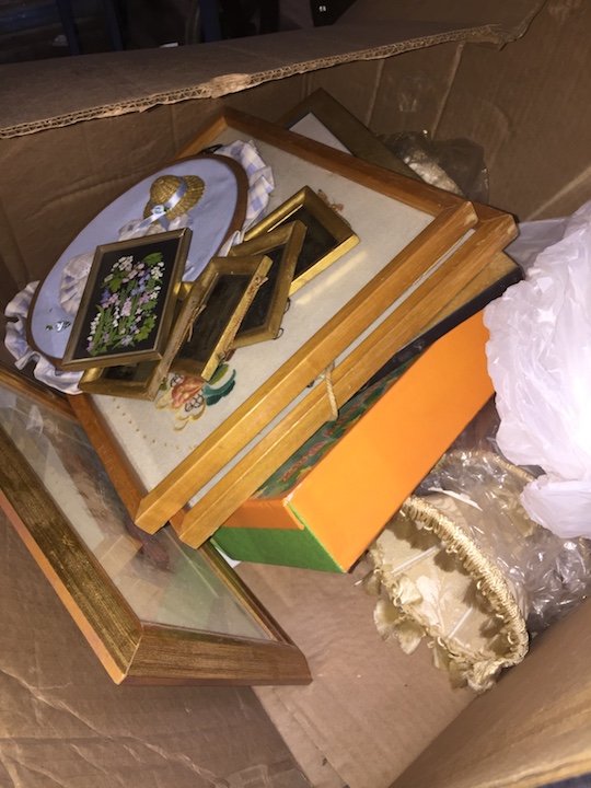 A box of mainly prints and pictures.