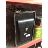 A vintage Franzen professional large black leather briefcase with combo lock.