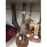 A pair of taxidermy hoof candlesticks