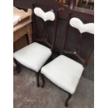 A pair of Edwardian mahogany chairs