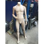 A headless male mannequin