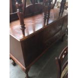 A mahogany sideboard on claw and ball feet with rail back