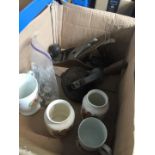 A box of misc to include commemorative pottery, brace and bit drill and a plane.