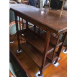 A mahogany flip top games table/trolley