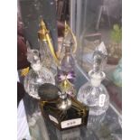 A collection of glassware including perfume sprays etc
