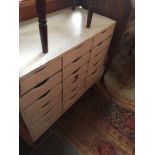A vintage painted multi drawer unit